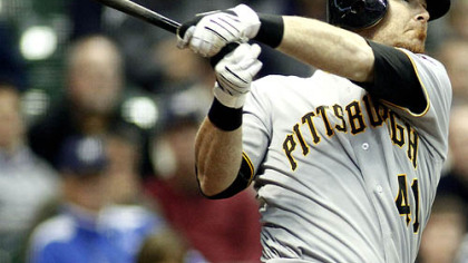 The Pirates' Ryan Doumit sends Milwaukee closer Trevor Hoffman's 2-0 fastball into the second deck in right field for the winning grand slam in the ninth inning.
