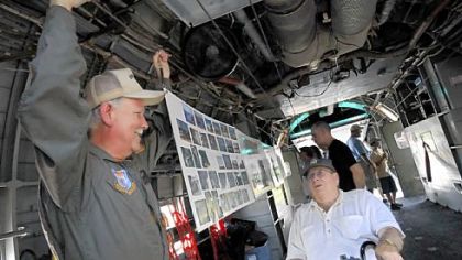 Don Mansfield, left, from the Air Heritage Museum based at Butler County Airport, talks with Dave Bovard, 77, of Harrisville, on a C-123 during the Warbirds Experience on Saturday. Mr. Bovard flew C-123s in Vietnam for Air America, a civilian airline that was owned and operated by the CIA.