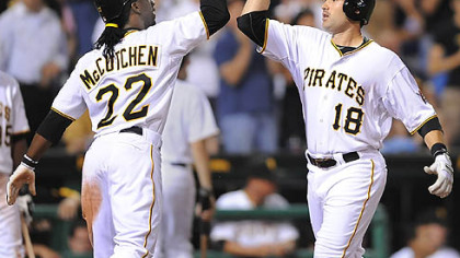 The Pirates' Neil Walker is greeted at home by Andrew McCutchen after Walker's two-run home run in the eighth inning Tuesday at PNC Park.