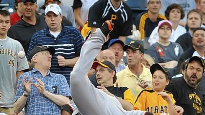Giants third baseman Pablo Sandoval tumbles over the tarp and into the stands chasing a foul pop Saturday night at PNC Park.