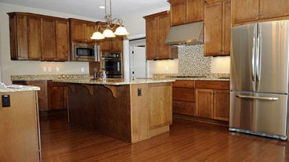 The 12-by-13-foot remodeled custom kitchen has a copper-topped center island and walk-in pantry.