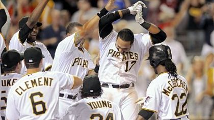 Pedro Alvarez (17) is congratulated after his walkoff home run in the 10th inning Saturday at PNC Park.