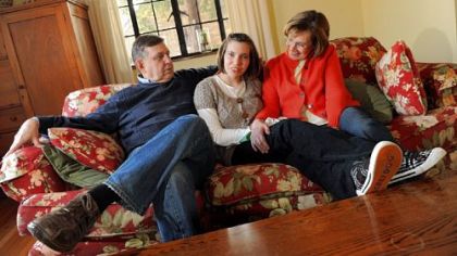 Russell and Robalee Bruesewitz sit with their 18-year-old daughter Hannah, center, at their home on Lebanon Avenue in Mt. Lebanon on Monday.  The U.S. Supreme Court will hear a case brought by the Bruesewitzs on Hannah's behalf.