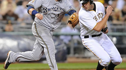 Brewers third baseman Casey McGehee tags out the Pirates' Bobby Crosby in a rundown.