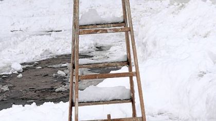 A ladder is used to mark a parking spot on Wightman near Bartlett in Squirrel Hill.
