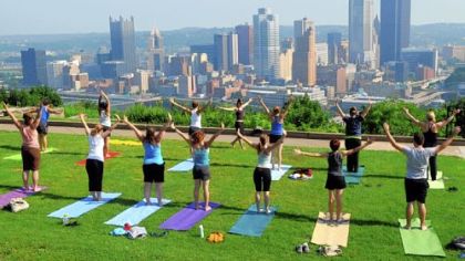 Lori Grabel teaches Breathe Yoga's outdoor class in Mt. Washington's Grandview Park overlooking Downtown Pittsburgh