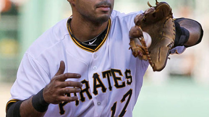 The Pirates' Pedro Alvarez fields a grounder by the White Sox's Carlos Quentin during the second inning.