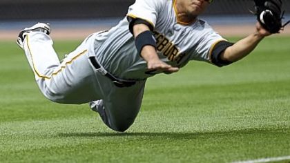 Pirates right fielder Delwyn Young makes a diving catch to retire the Braves' Troy Glaus in the seventh inning Sunday at Turner Field.