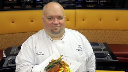 Share Wine Lounge & Small Plates Bistro executive chef Chris Jones with the Tuscan Chop -- an oven-roasted pork chop with garlic cloves, rosemary, fingerling potatoes and market vegetables.