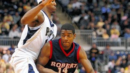 Pitt's Gilbert Brown guards Robert Morris' Gary Wallace, right, in Pitt's 92-72 victory on Feb. 2, 2009.