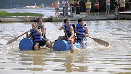 Paddling in an "Anything That Floats" contest on Lake Courage are, in craft at left, Dakota Korinko, 11, front, and Aaron Funaiock, 14. In craft at right are Matt Gwynn, 13, front, and Tony Donatelli, 14. All belong to South Park Troop 510.