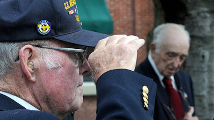 Wilbur Driscoll, a member of the Mon Valley chapter of the Merchant Marine, salutes during the dedication of the World War II U.S. Merchant Marine Monument in Butler's Diamond Park.