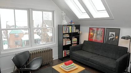 Because of allergies, the couple chose to keep hot water heating, as shown in the home office.