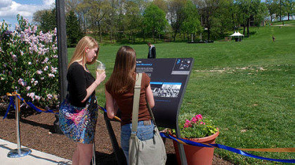 Cathleen Matuzak, left, a freshman architecture student from Mars, and Kayla Perkins, a Spanish translation freshman from Bellville, Ohio, look at the area that has been placed on the National Register of Historic Places to mark the May 4, 1970, killings of four students on the Kent State University campus by the Ohio National Guard.