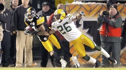 The Steelers' Mike Wallace pulls in the winning touchdown pass as time expires in a wild 36-33 win over the Green Bay Packers at Heinz Field on December 20, 2009.