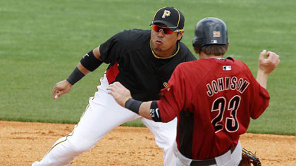 Pirates second baseman Aki Iwamura is pulled off the bag by a throw from catcher Ryan Doumit as Astros third baseman Chris Johnson (23) steals second during the second inning.