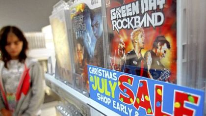 Video games are among items promoted Monday for a "Christmas in July Sale" at a Toys R Us store in New York.