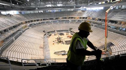 Joe Thompson of Homestead installs seats in the upper level of the new Consol Energy Center.