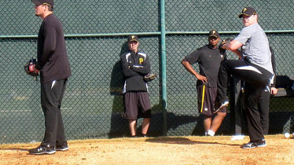 Pirates relievers Joel Hanrahan, left, and Evan Meek work off the mounds Wednesday at Pirate City in Bradenton, Fla. In the background are Jeff Karstens and Donnie Veal.