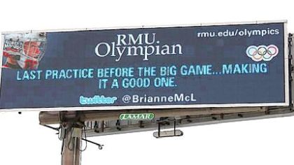 A billboard along the Parkway West shows the first tweet by Brianne McLaughlin, a Robert Morris University student and a goalie for the U.S. women's hockey team at the Winter Olymics in Vancouver. Lamar Advertising sold the billboard space to the university.