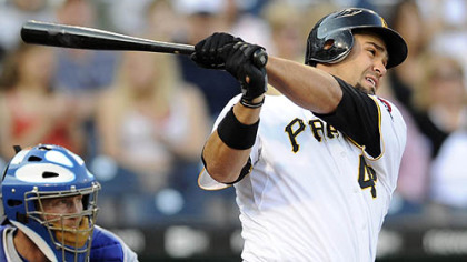 The Pirates' Garrett Jones hits in a run in the first inning.