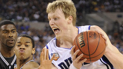 Duke's Kyle Singler drives to the net against Butler's Ronald Nored in the first half.