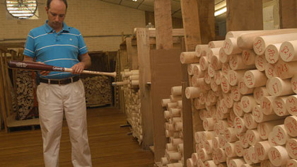 Mike Gregory, vice president of BWP Bats, inspects a bat designed for Minnesota Twins first baseman Justin Morneau.