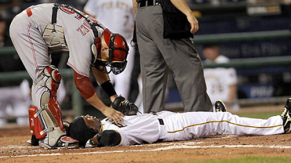 Reds catcher Ramon Hernandez checks on Andrew McCutchen after he was hit by a pitch Tuesday.