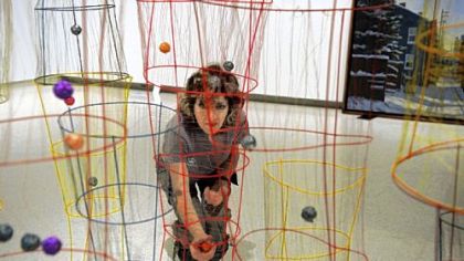 Artist Lori Hornell installs her artwork "Wired" in the 100th Annual Exhibition of the Associated Artists of Pittsburgh in the Carnegie Museum of Art.