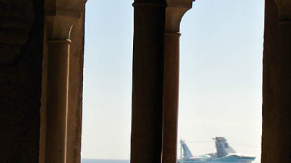 Crystal Serenity as seen from the port of Malaga, Spain. Top: Upper decks offer afternoon tea with a view.