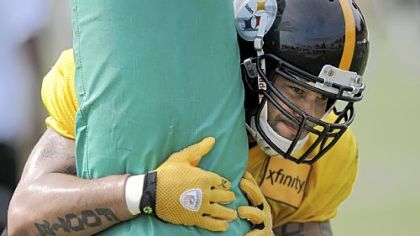 Larry Foote works out during training camp Monday in Latrobe.