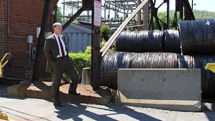 Democratic congressional candidate Mark Critz waits outside the rod and wire mill in Johnstown to shake hands with departing workers during a shift change. Mr. Critz is tied statistically in the polls in his quest to succeed the late U.S. Rep. John P. Murtha.