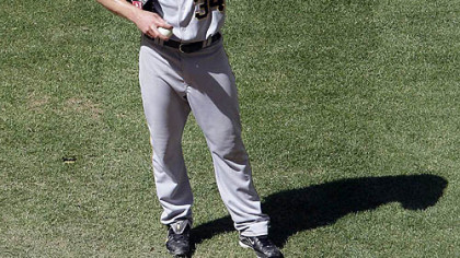 Pirates' Daniel McCutchen pauses behind the pitching mound after giving up back-to-back home runs to the Diamondbacks in the fourth inning of the Pirates loss in Phoenix.