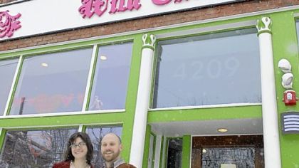 Rebecca Morris and Brian Mendelssohn in front of their renovated building in Lawrenceville.
