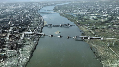 In this still from the film "City of Ruins," the ruins of bridges on the Vistula River are seen in Warsaw in 1944 after the uprising.