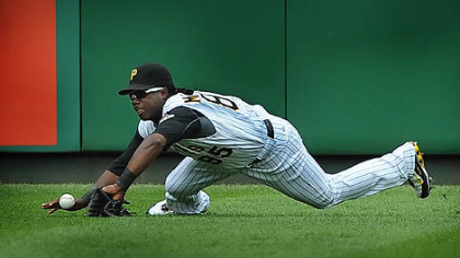 Left fielder Lastings Milledge dives but can't make the catch on a ball hit by the Giants' Juan Uribe for a run-scoring single in the ninth inning Sunday at PNC Park.