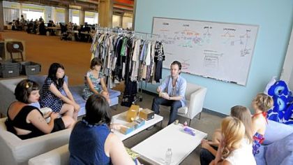 Richard Brown leads a brainstorming session with team members at ModCloth.