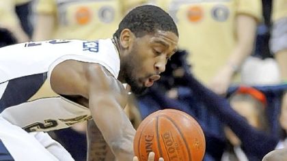 Pitt guard Brad Wanamaker looks for a steal as Robert Morris guard Velton Jones hits the floor in the first half.