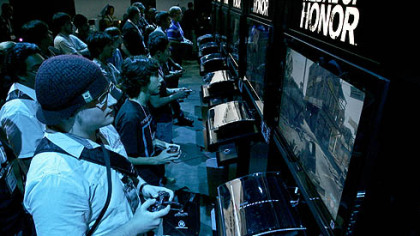 Attendees at the Electronic Entertainment Expo in Los Angeles try out the Electronics Arts' "Medal of Honor" game.