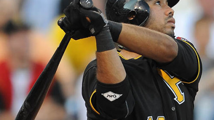 The Pirates' Pedro Alvarez waits in the dugout for an at-bat during the first inning.