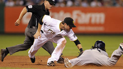 The Brewers' Rickie Weeks slides safely into second base against the Pirates' Neil Walker in the sixth inning.