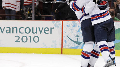 Ryan Kesler is congratulated by U.S. teammate Zach Parise after his empty-netter sealed the victory.