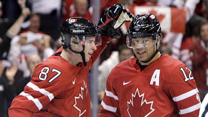 Sidney Crosby congratulates Canada linemate Jarome Iginla on a goal during the 2010 Winter Olympics in Vancouver.