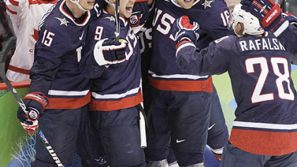 Zach Parise, 9, celebrates his goal to send the gold-medal game into overtime.