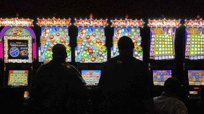 Gamblers at the slots at The Meadows Racetrack and Casino.