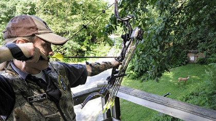 Instructor Paul Kaminar takes aim at a target during a safety class on bowhunting at the Allegheny County Rifle Club in Ross.