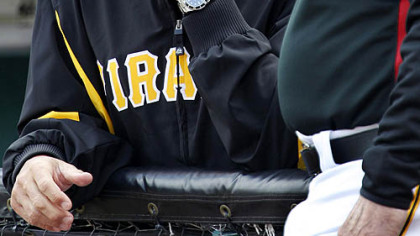 Pirates manager John Russell, left, talks with coach Bill Virdon before the game.