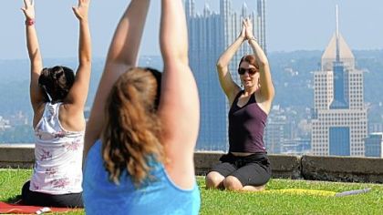 Lori Grabel teaches Breathe Yoga's outdoor class in Mt. Washington's Grandview Park overlooking Downtown Pittsburgh.