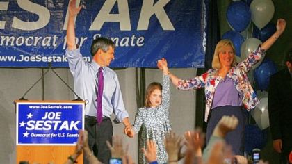 Rep. Joe Sestak with his daughter, Alex, and his wife, Susan, speaks to a primary watch event crowd in Wayne, Pa.