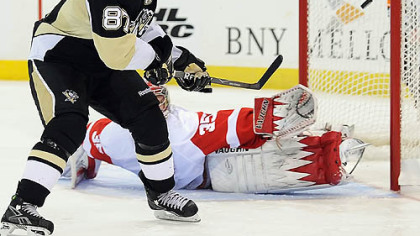 Sidney Crosby scores the winning goal in the shootout against Red Wings goalie Jimmy Howard Sunday at Mellon Arena.